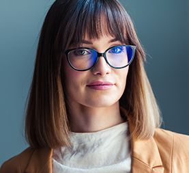 Woman wearing Guess Brand Glasses