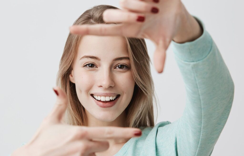 woman using hands to show frame around face